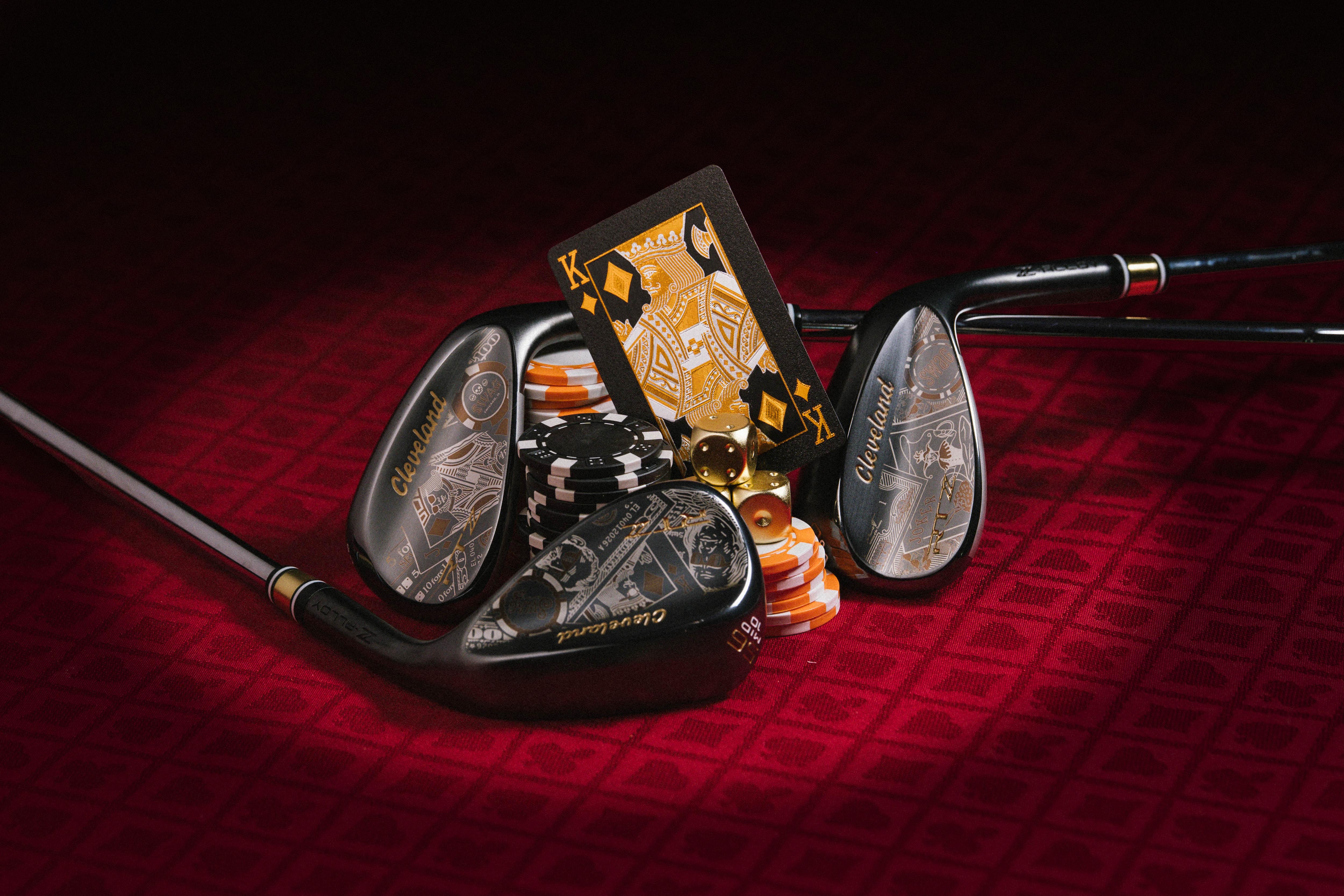 SWAG Golf x Cleveland Golf and Srixon High Roller Collection featuring gambling themed wedges and golf balls.