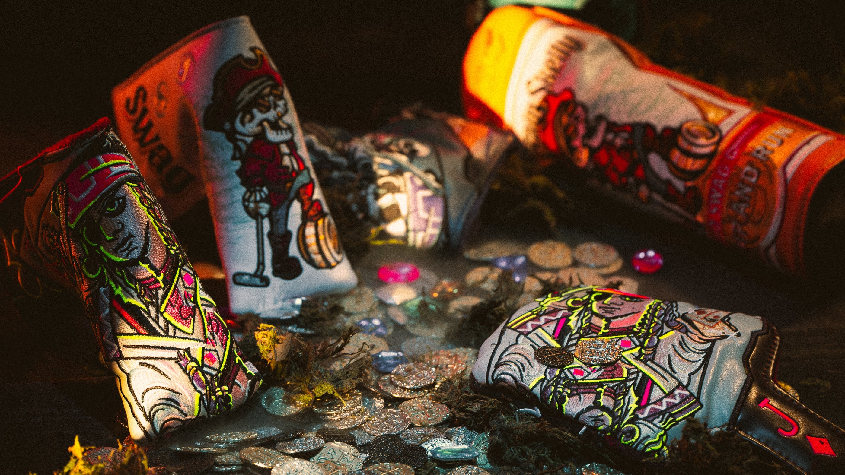 SWAG's Lost Treasure Collection of limited edition golf headcovers, accessories, and a carbon steel putter.