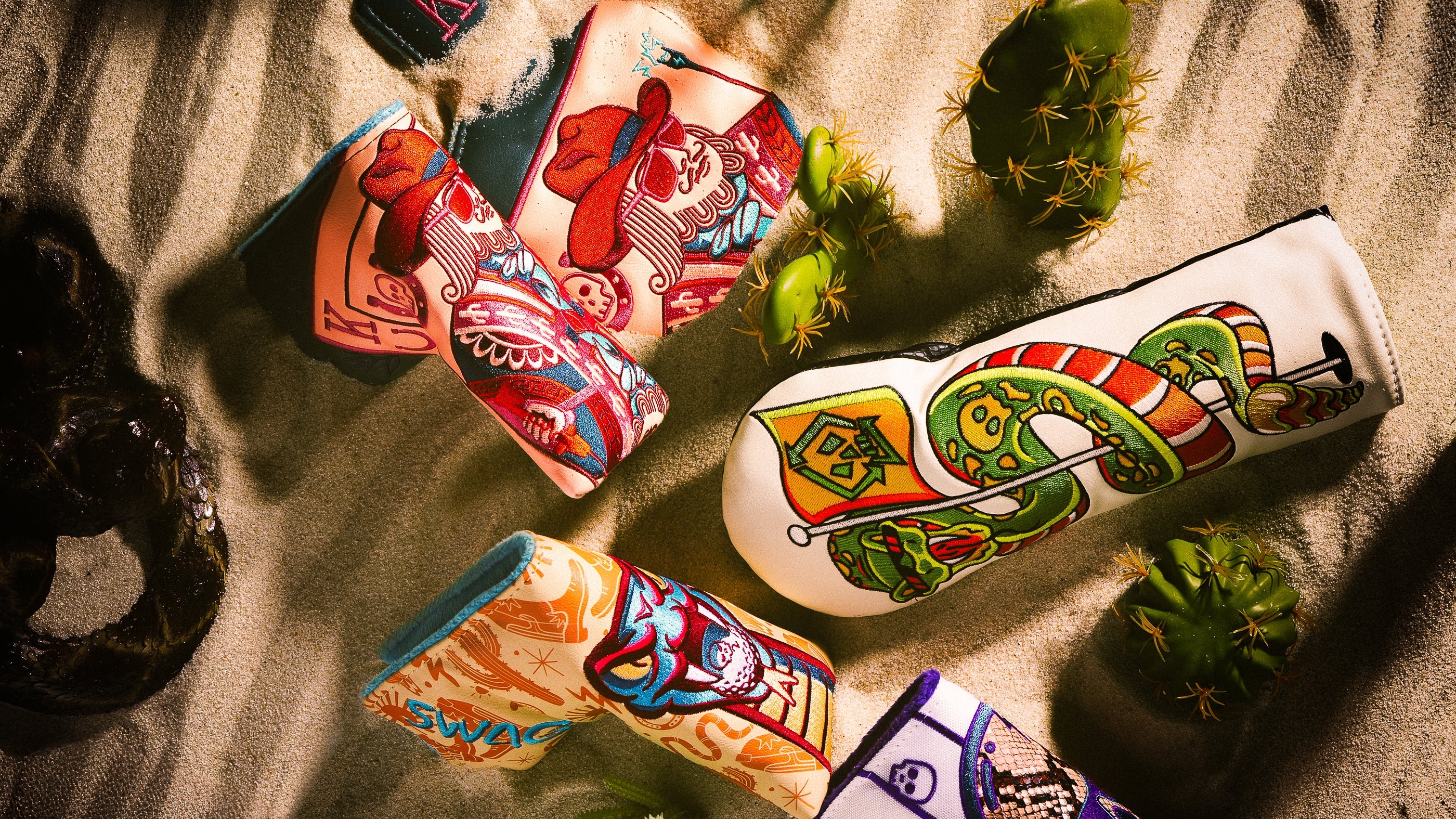 SWAG Golf Desert 2026 limited edition collection featuring golf headcovers, accessories, and a putter.
