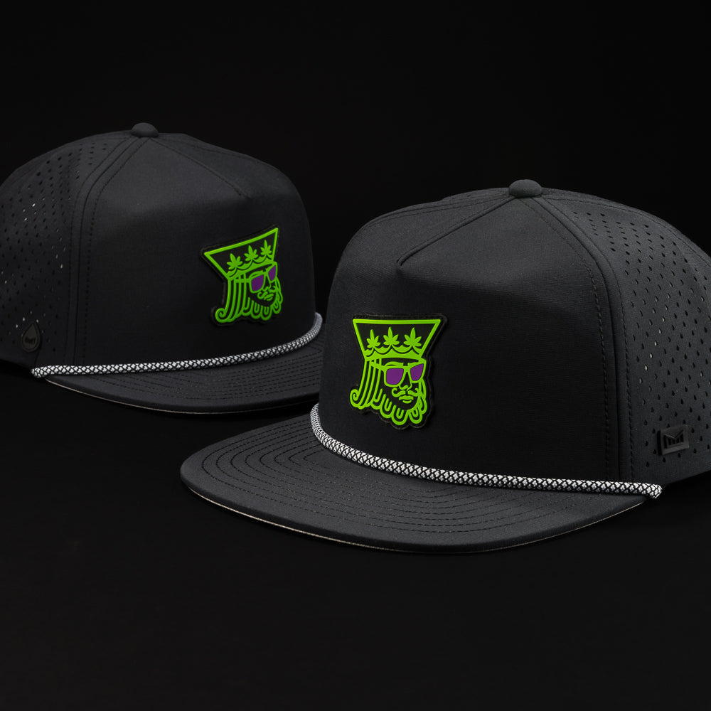 Melin Coronado Royal Highness snapback hat in black with green and purple.