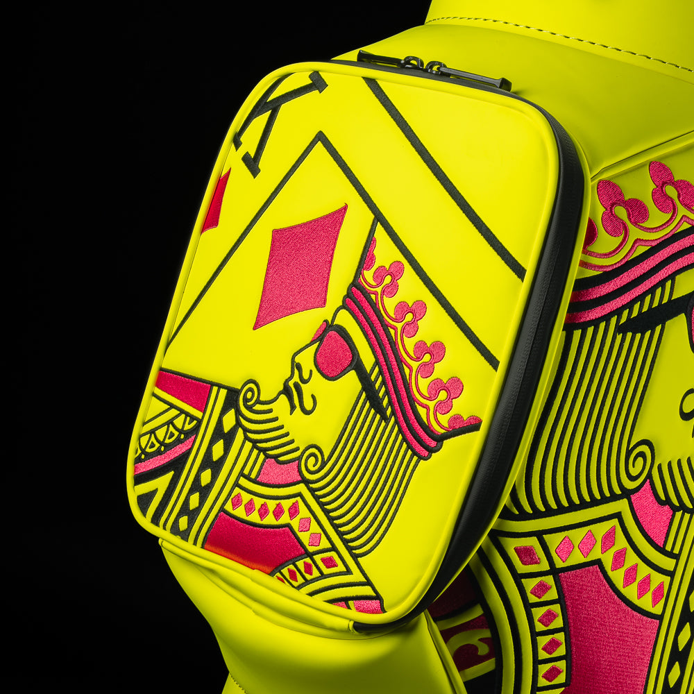 Neon yellow SWAG Golf den caddy zippered cooler with neon pink and black King playing card embroidered design.