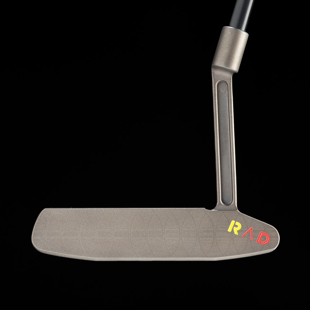 SWAG Golf RAD Handsome Too Longneck limited edition golf putter with a black oxide finish, sound slot, and red and yellow dripping skull design on the sole.