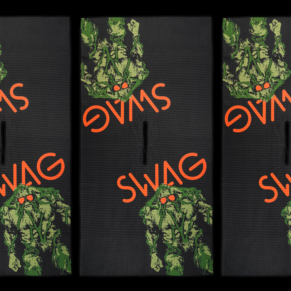 SWAG Golf SWAG Thing towel with green creature graphic and bold SWAG lettering on black microfiber golf towel.