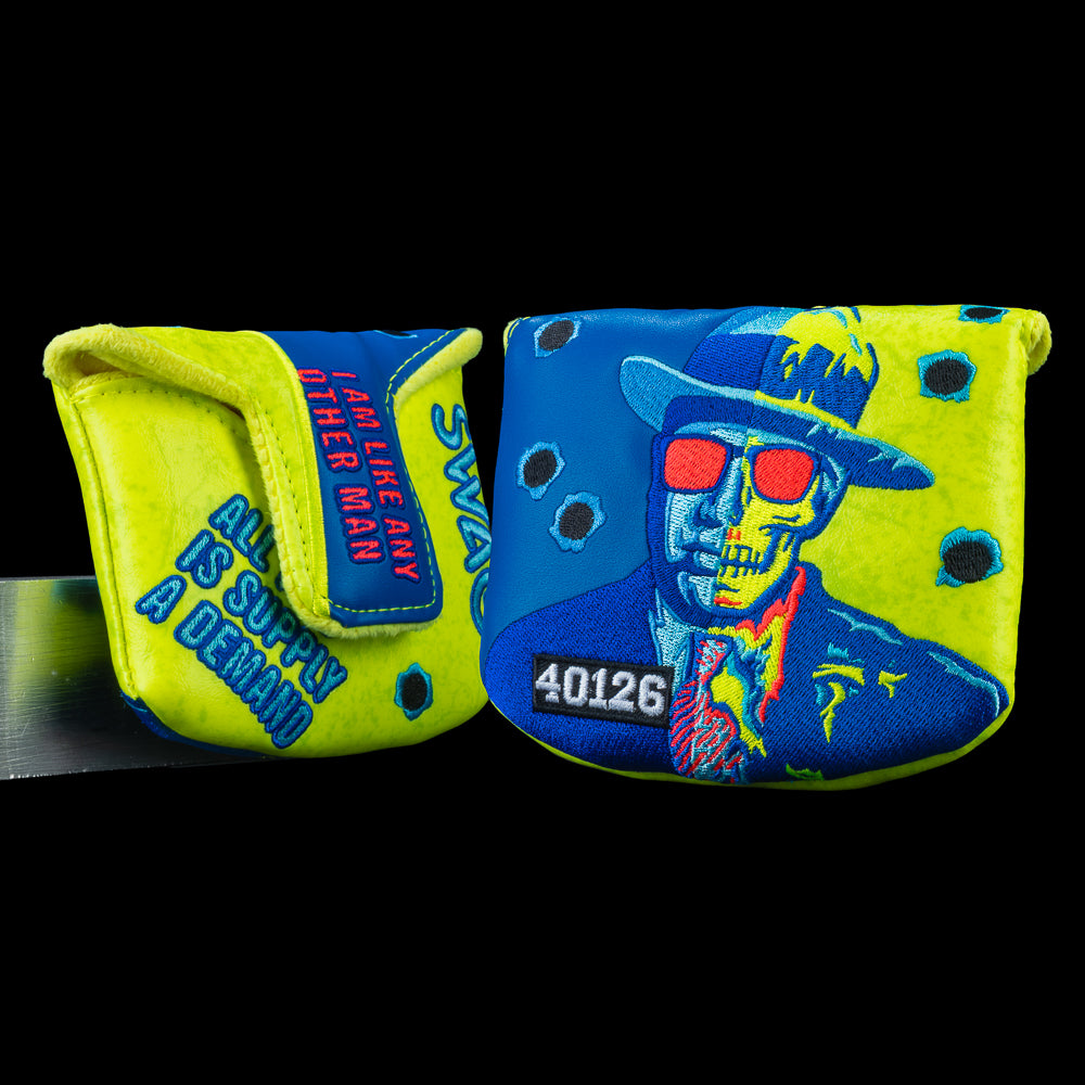 Two-Faced Capone mallet headcover with blue and yellow Capone graphic and bullet hole details.