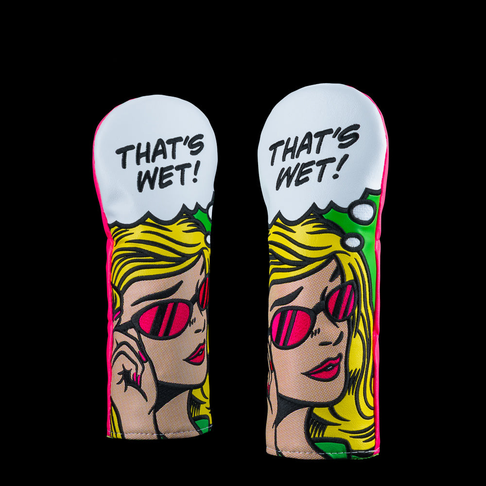 SWAG Golf headcovers featuring comic artwork with blonde character and speech bubble reading “That’s Wet” in bright pop art style.