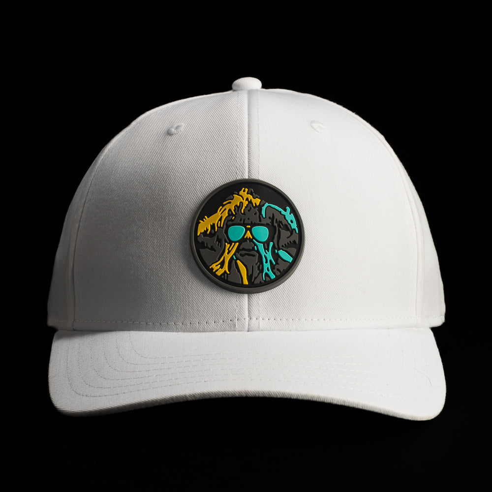 Front view of a white SWAG Thing hat featuring a round multicolor patch with teal, orange, and black graphic artwork.