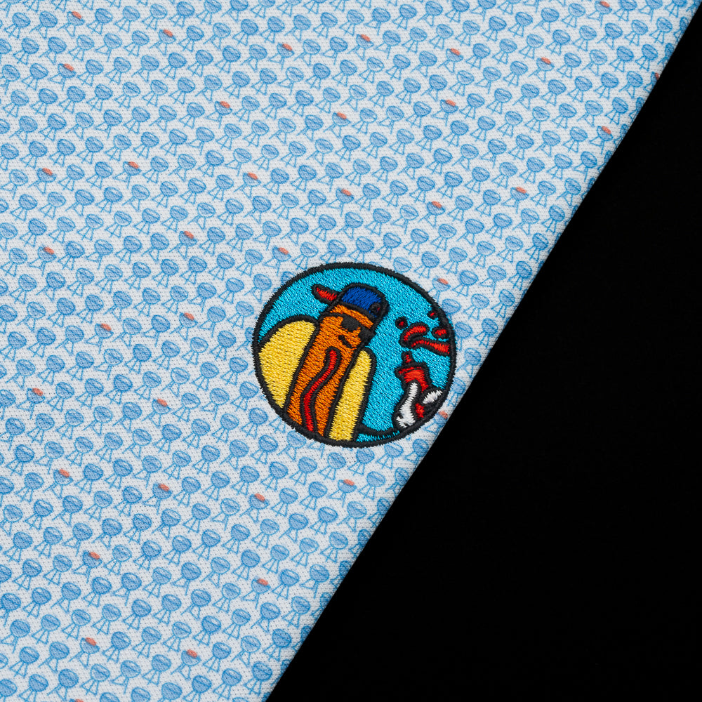 Blue Bbq printt Peter Millar Polo with a hot dog patch with blue, yellow and red.
