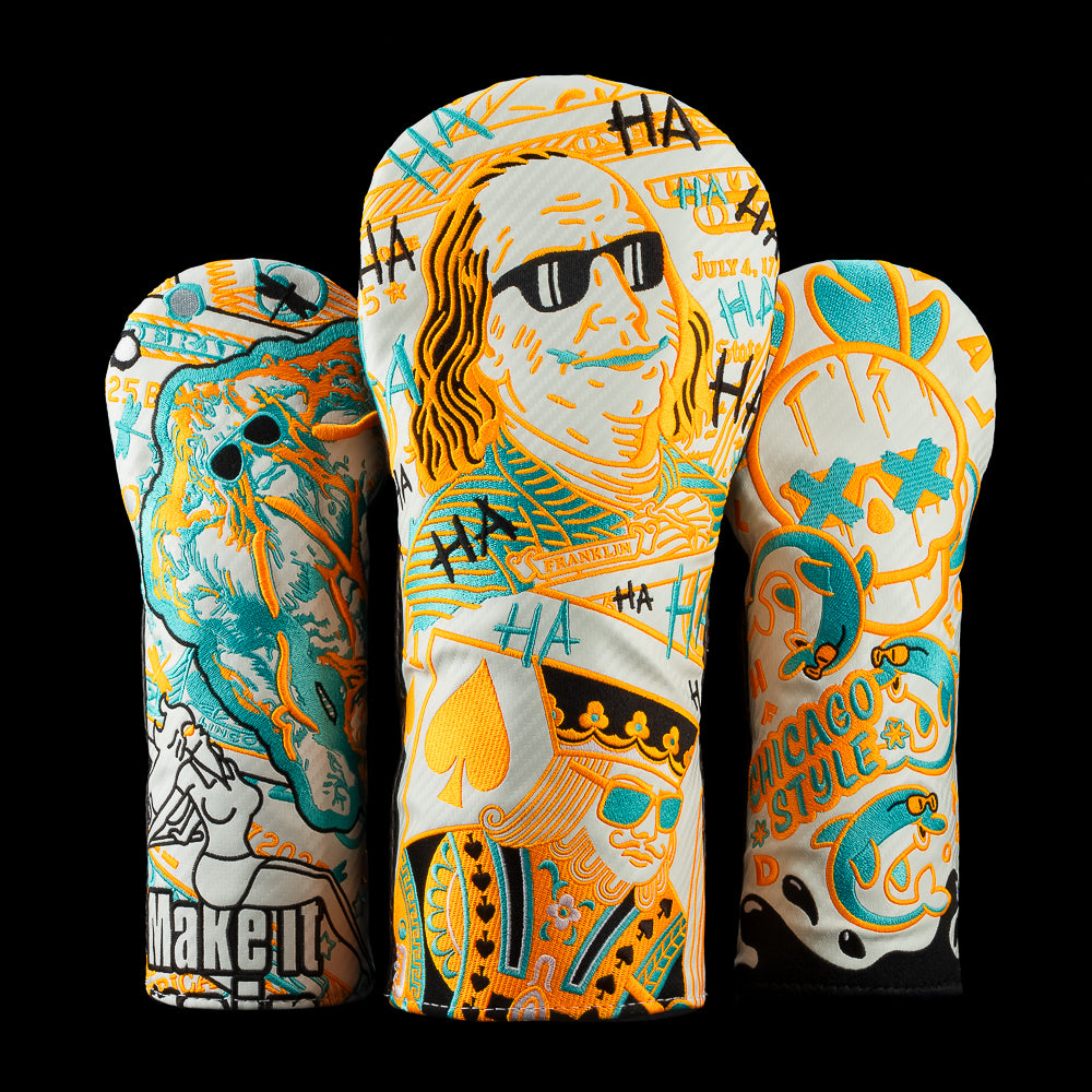 Set of three SWAG Golf headcovers decorated with detailed, colorful embroidery. Artwork includes a cartoon Benjamin Franklin wearing shades, stylized playing cards, comic HA patterns, and Chicago-inspired graphics. The covers have a vibrant, graffiti-driven aesthetic.