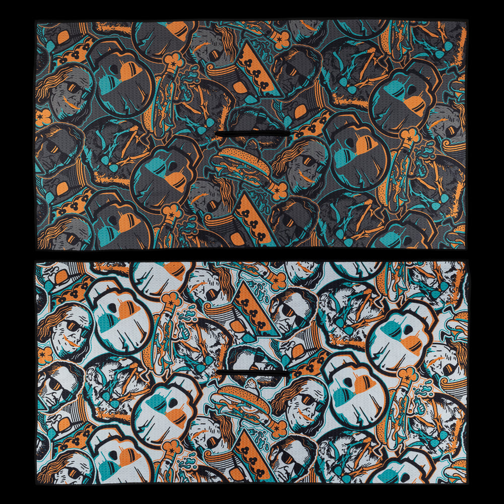 Black and white versions of the BF25 Greatest Hits towel, each covered in SWAG Golf’s signature collage of skull motifs, crowns, and illustrated characters.