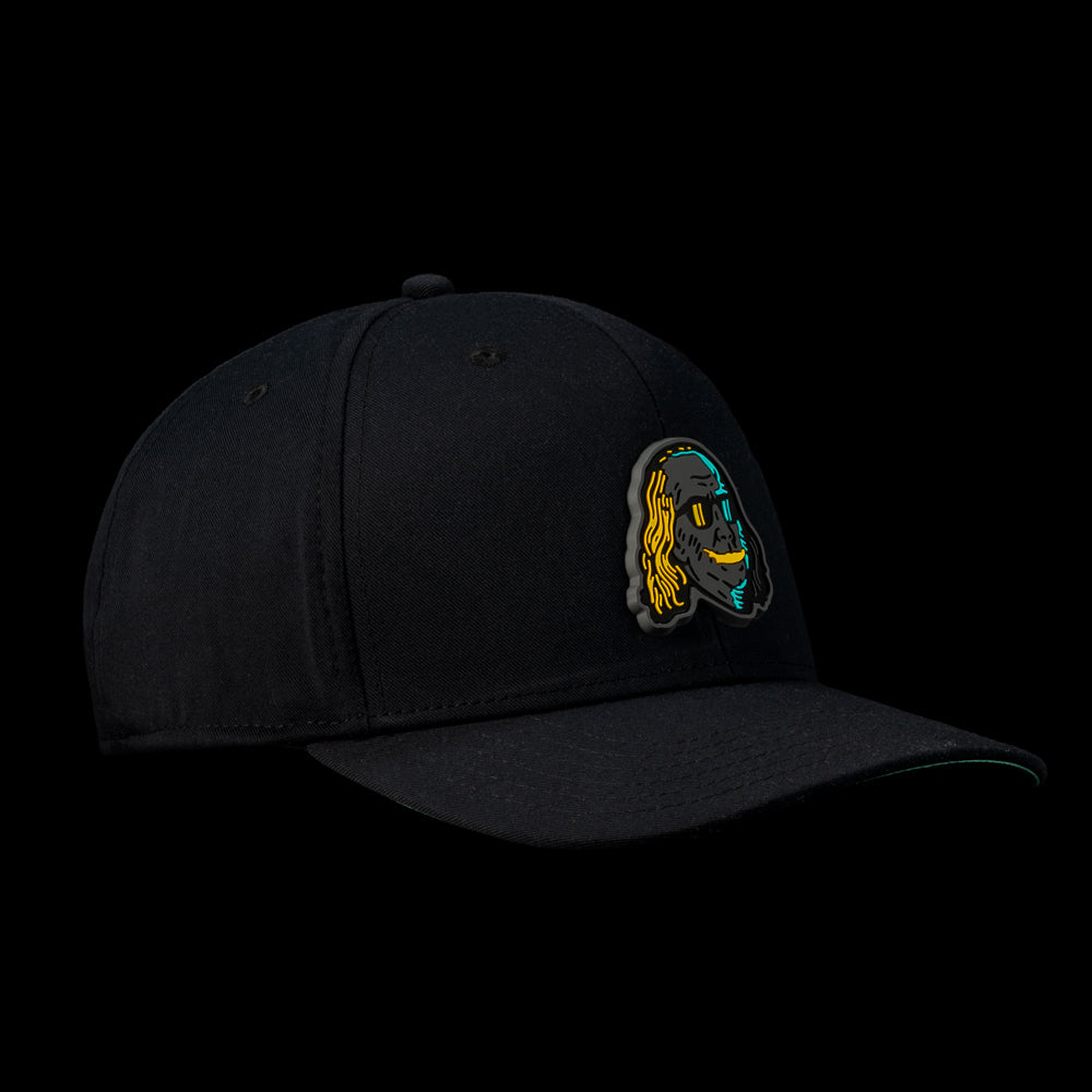 Side view of the Black Defaced Franklin hat featuring a patch of Franklin’s face illustrated in teal, orange, and black.