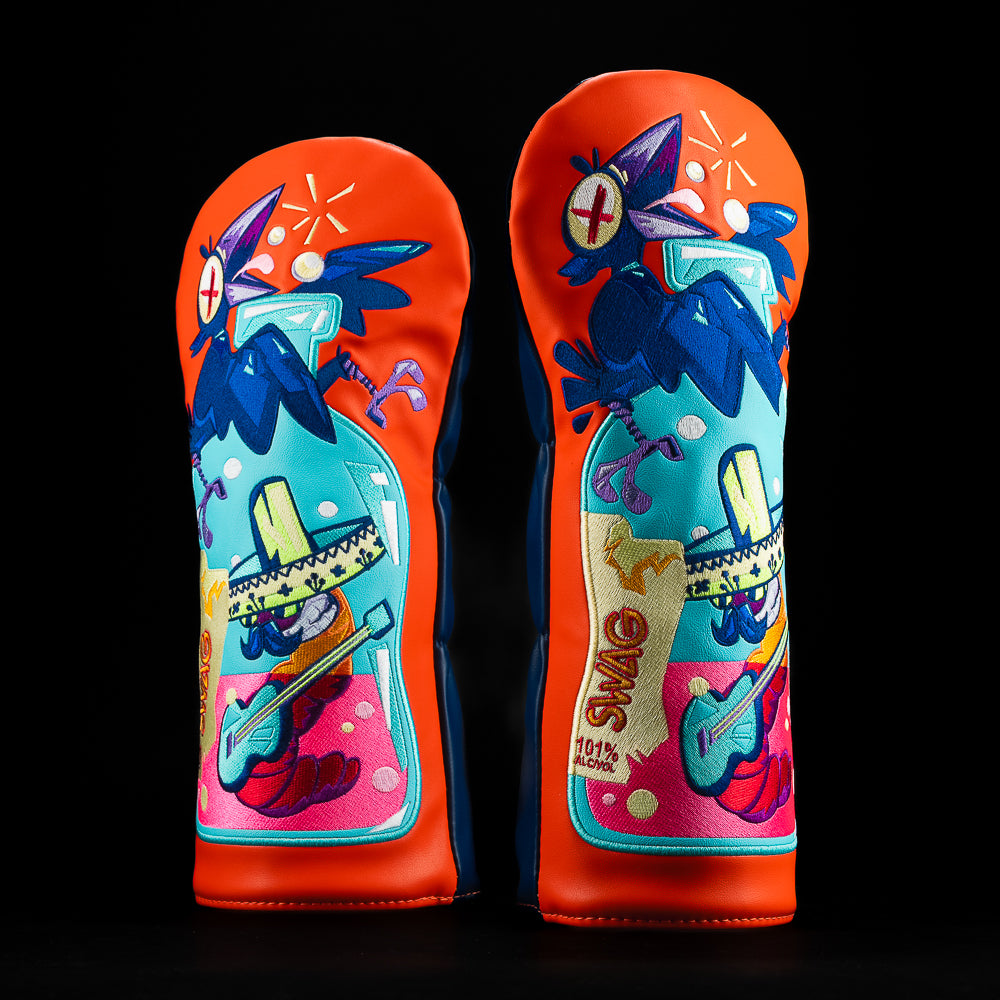 Bright orange SWAG Golf driver cover featuring a colorful Cinco de Mayo themed design with a cartoon worm in a sombrero playing guitar and a bird above.