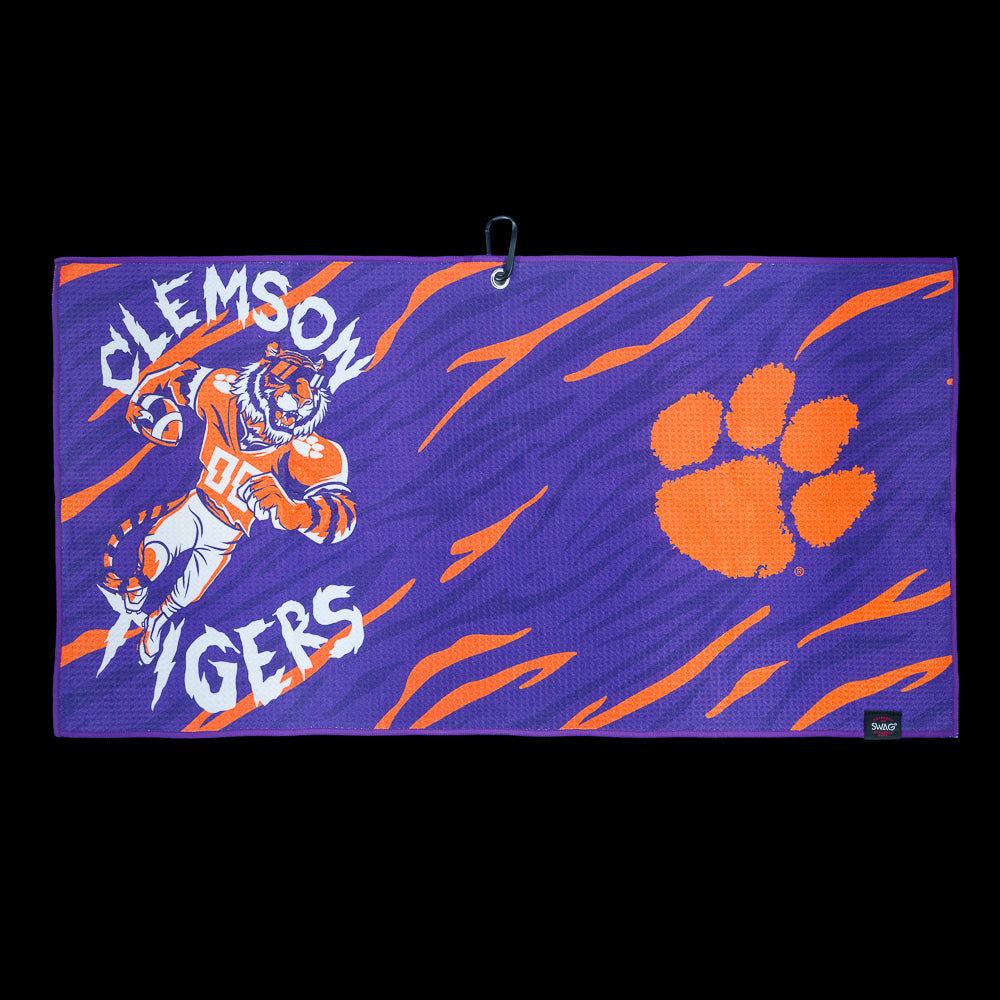 Purple Clemson Tigers golf towel with tiger mascot illustration, orange paw logo, and bold team graphics