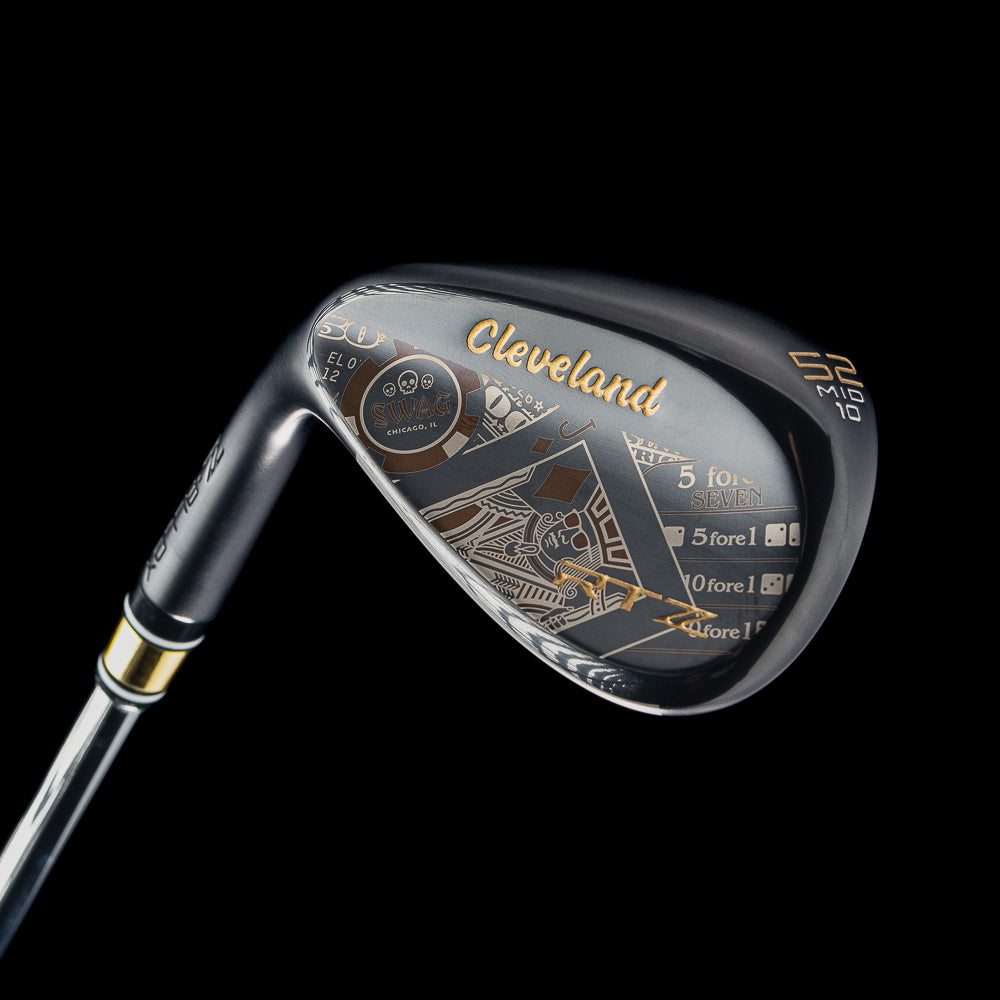 Black satin 52 degree left handed golf wedge with Cleveland x SWAG Golf branding on a black background