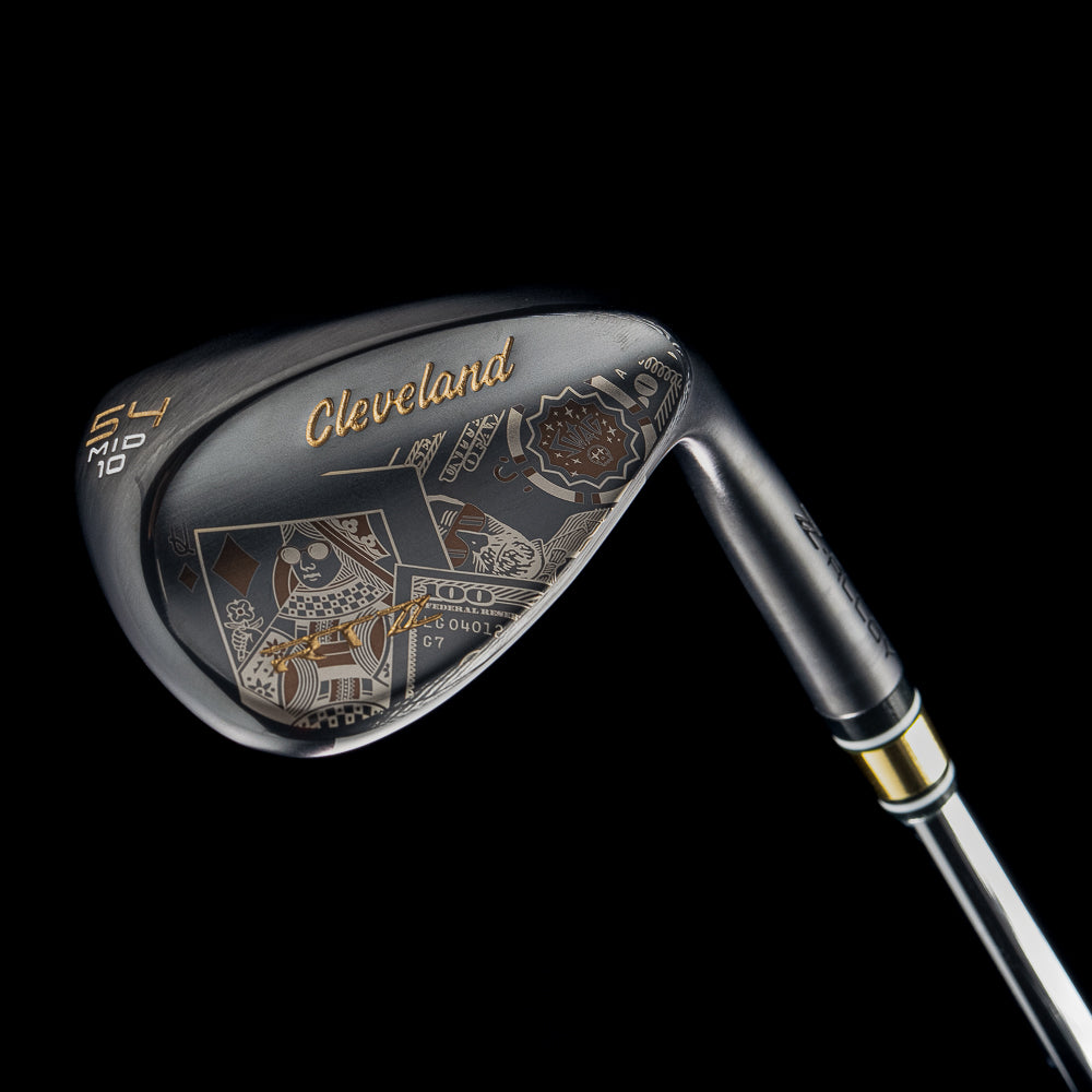 Black satin 54 degree golf wedge with Cleveland x SWAG Golf branding on a black background