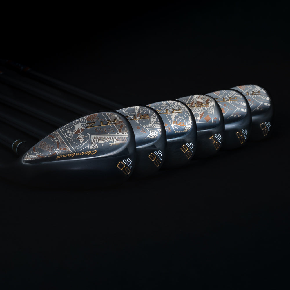 Set of golf wedges with intricate designs on a black background