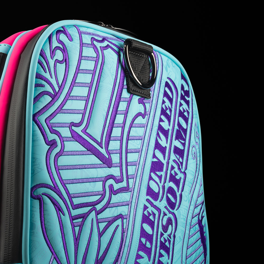 Bubblegum George aqua and neon pink duffel bag accessory with embroidered currency pattern.