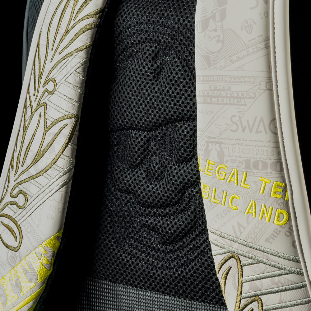 Cream currency themed backpack with 'SWAG' text and George washington embroidered details.