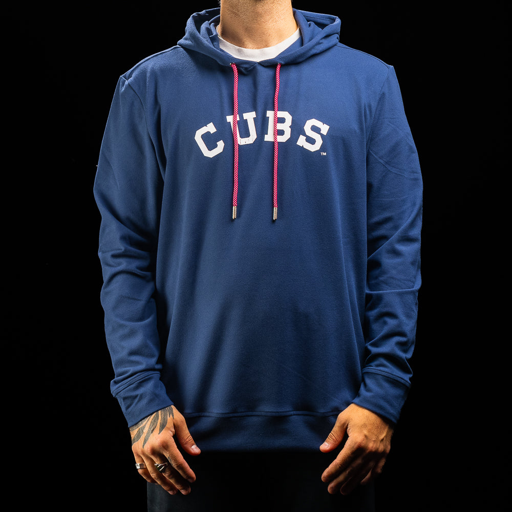 A person wearing a royal blue pullover hoodie with 'CUBS' printed in white arched letters across the chest and bright pink drawstrings, shown against a black background.