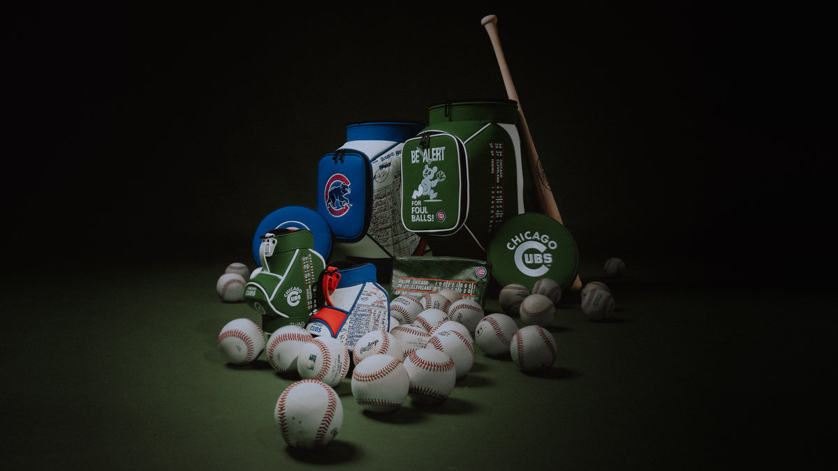 Chicago Cubs x SWAG Golf official collection featuring den caddy coolers and desk caddies on a green background with a bat and baseball balls.
