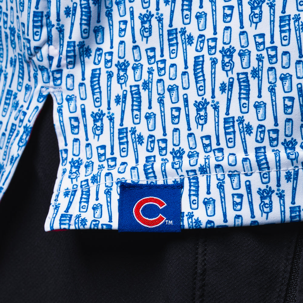 Close-up of the Chicago Cubs Beer Pattern Classic Polo Shirt hem with all-over beer graphics and embroidered Cubs logo.