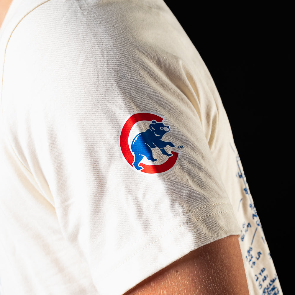 Close-up of the Chicago Cubs logo detail on the sleeve of the Game 7 Scorecard T-Shirt.
