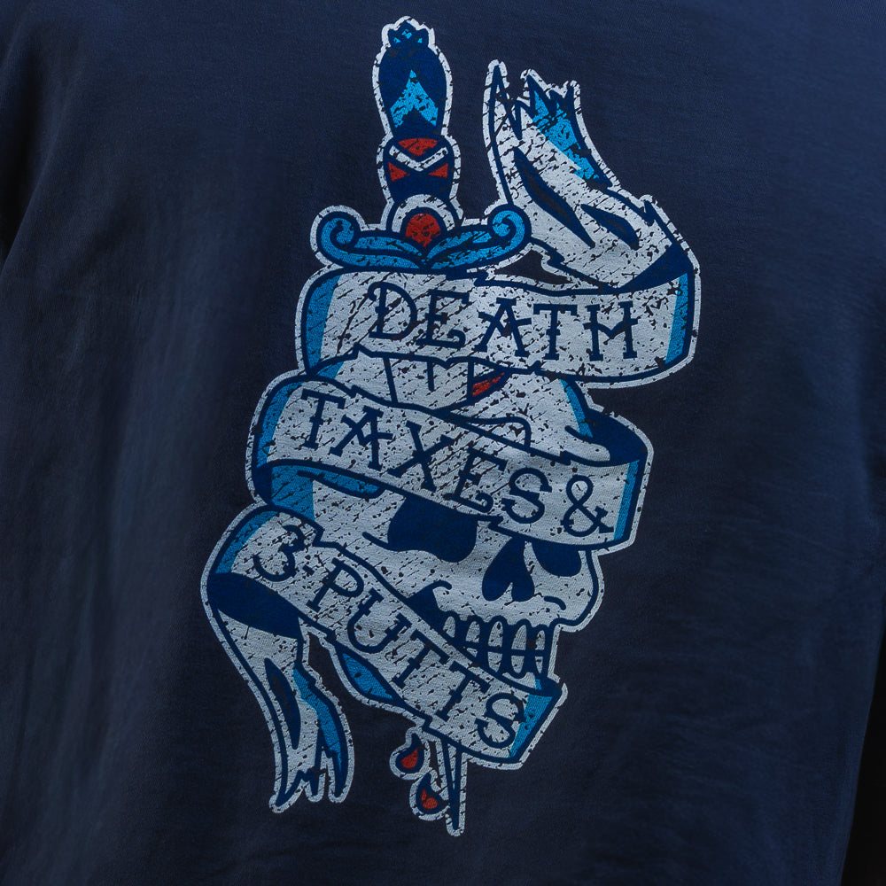 Person wearing a SWAG Golf navy blue short sleeve graphic t-shirt with a tattoo themed logo on the chest against a black background
