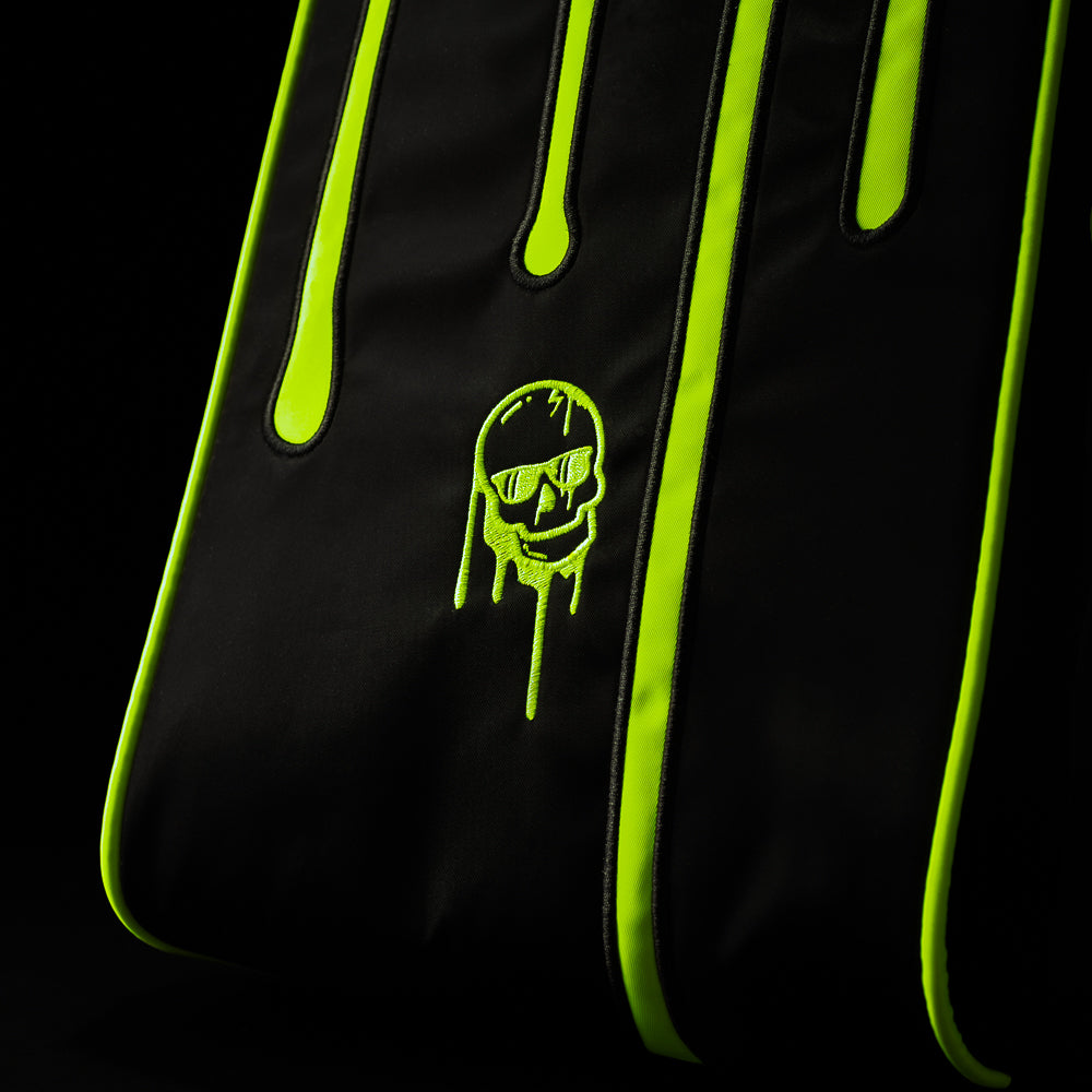 Neon green dripping skull logo on black SWAG Golf shoe bag with bold drip graphics and premium material finish.