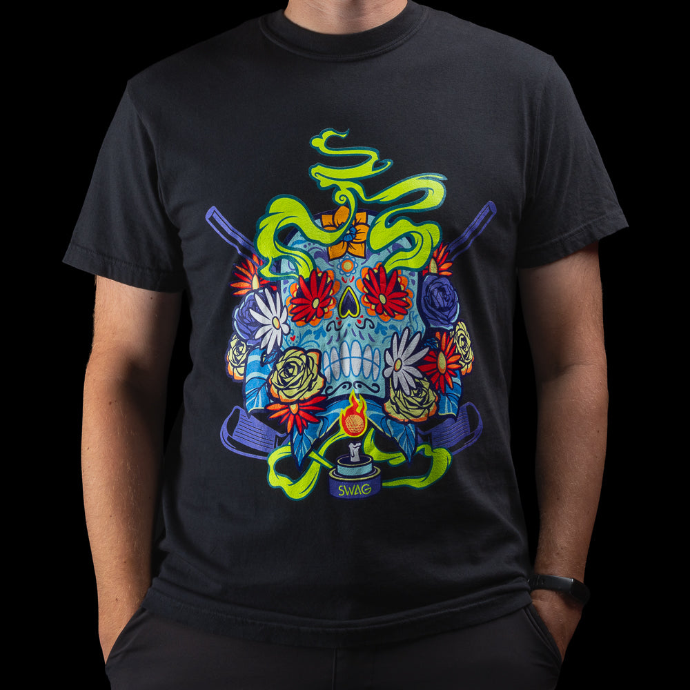 Día de los Muertos black t-shirt featuring colorful sugar skull and floral design with glowing accents by SWAG Golf.
