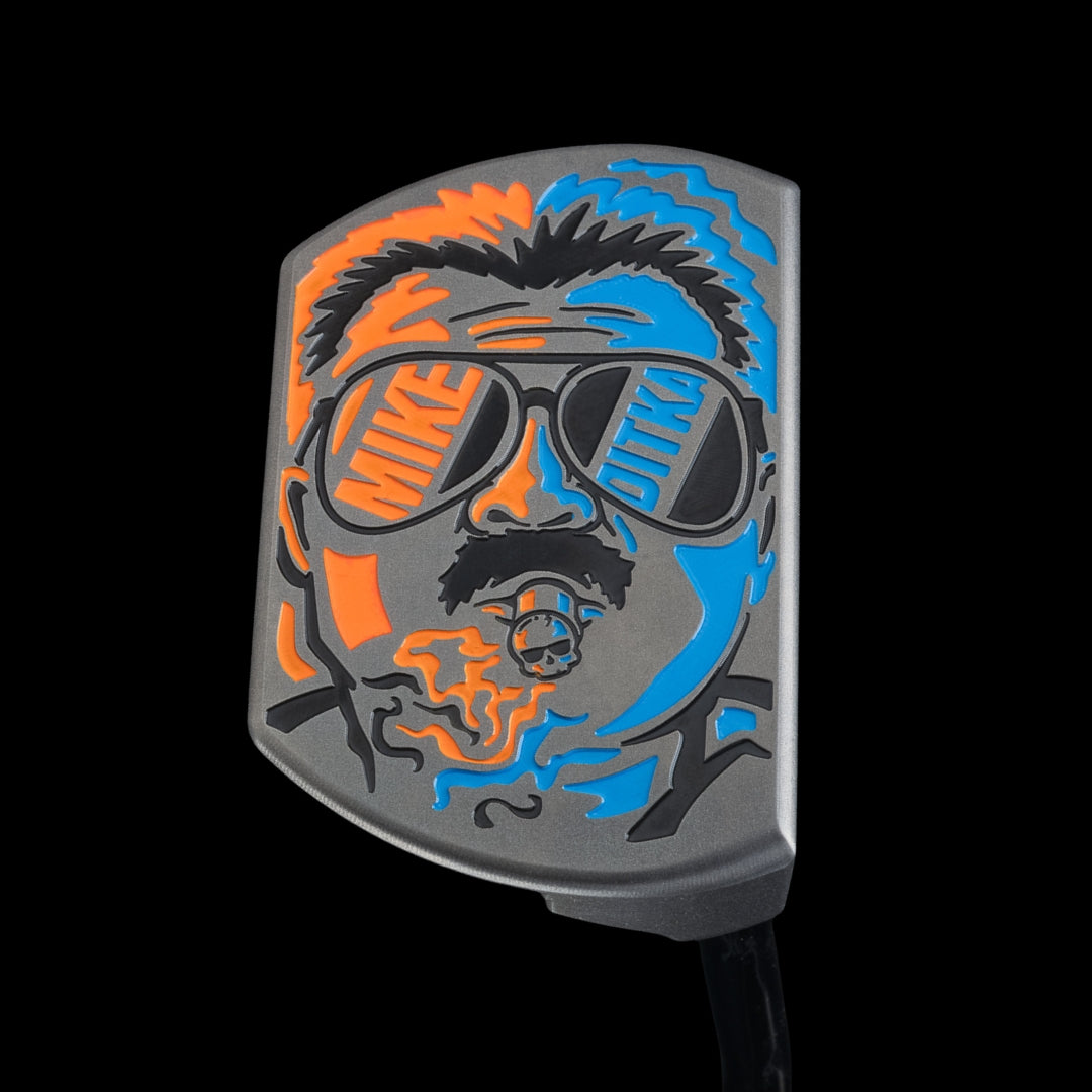 SWAG Golf x Mike Ditka Da Boss 2.0 limited edition black oxide mid-mallet golf putter made in the USA. Featuring Mike smoking a cigar with Chicago Bears orange and blue colors.
