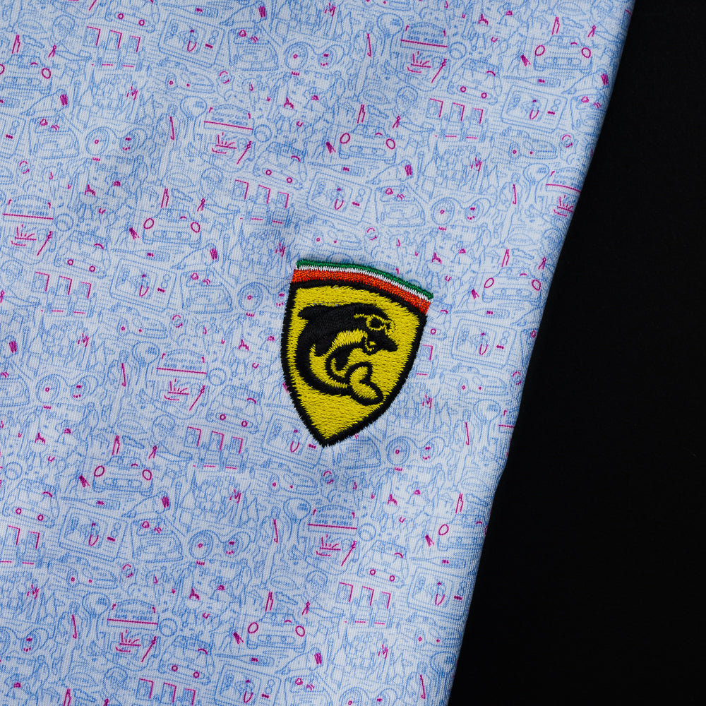 Swag x Peter Millar Chicago movie themed print men's short sleeve golf polo shirt with an embroidered yellow dolphin on the left chest.