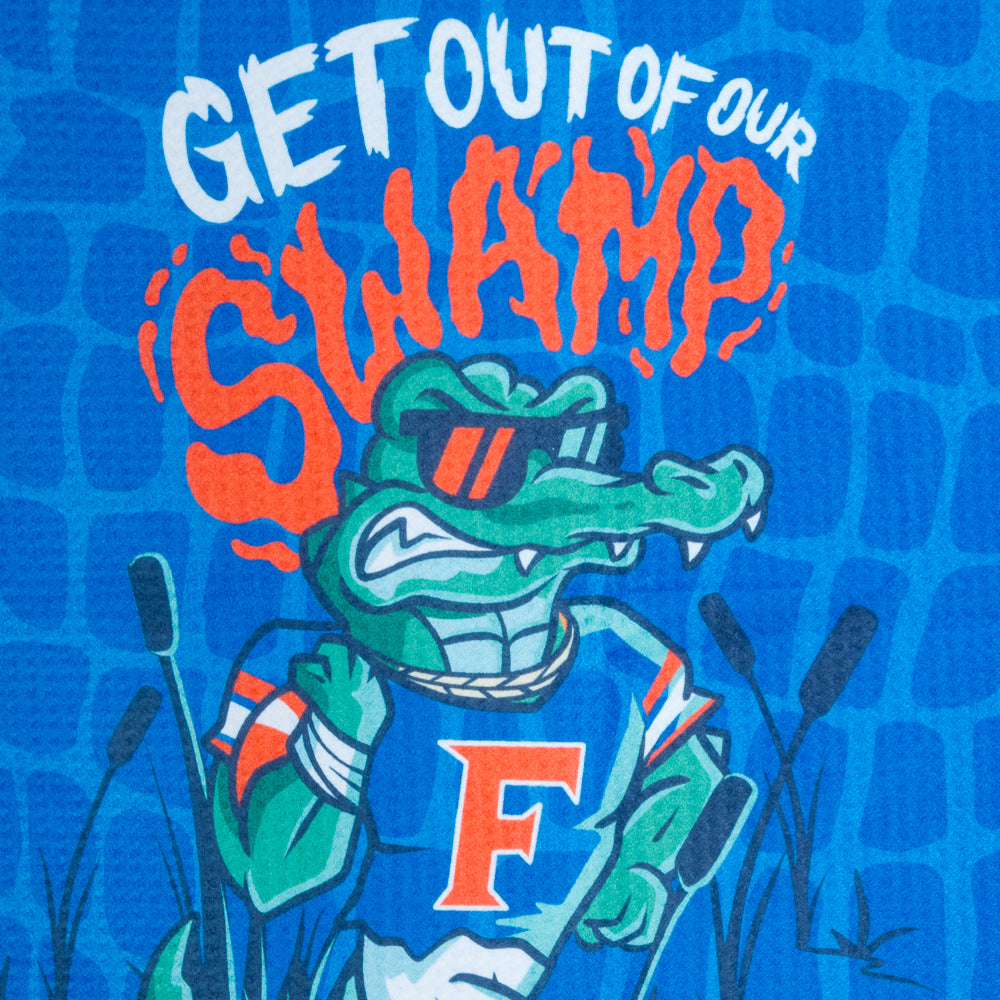 University of Florida Gators themed golf towel with cartoon gator and text on a blue background