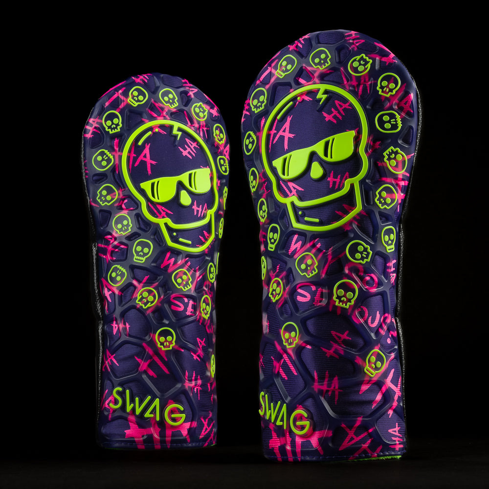 SWAG Purple TPU Defaced Skull driver golf headcover with neon green and neon pink accents.