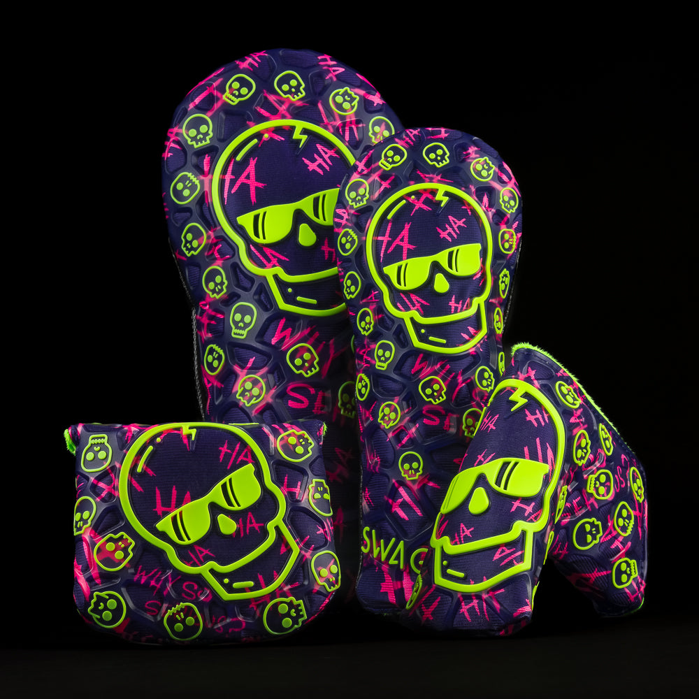Purple TPU Defaced Skull driver, fairway, mallet and blade headcover with neon green and neon pink accents.