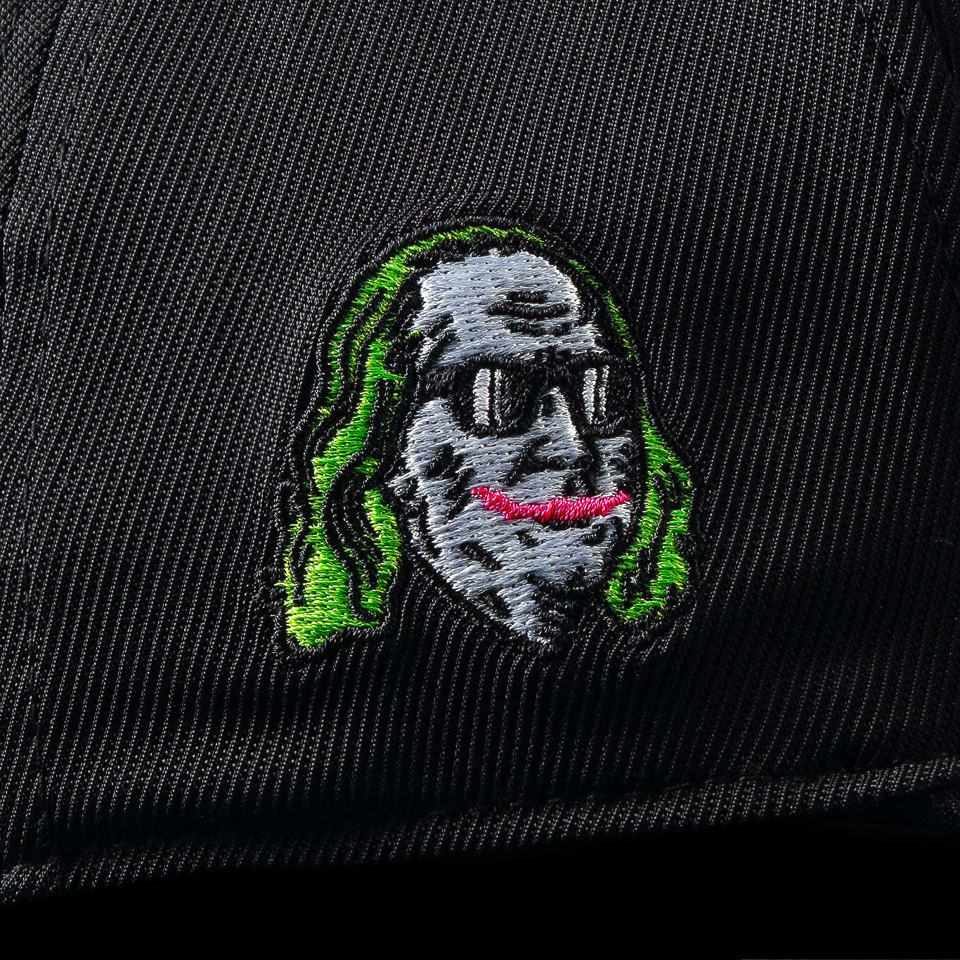 G/Fore flexfit 110 black golf cap with pink 'HAHA' text.