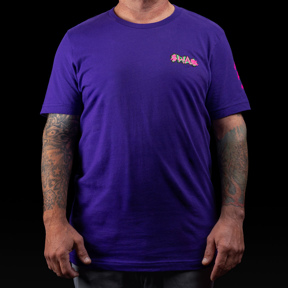 Purple SWAG t-shirt with neon joker skull king graphic and graffiti HA scribbles on the back.