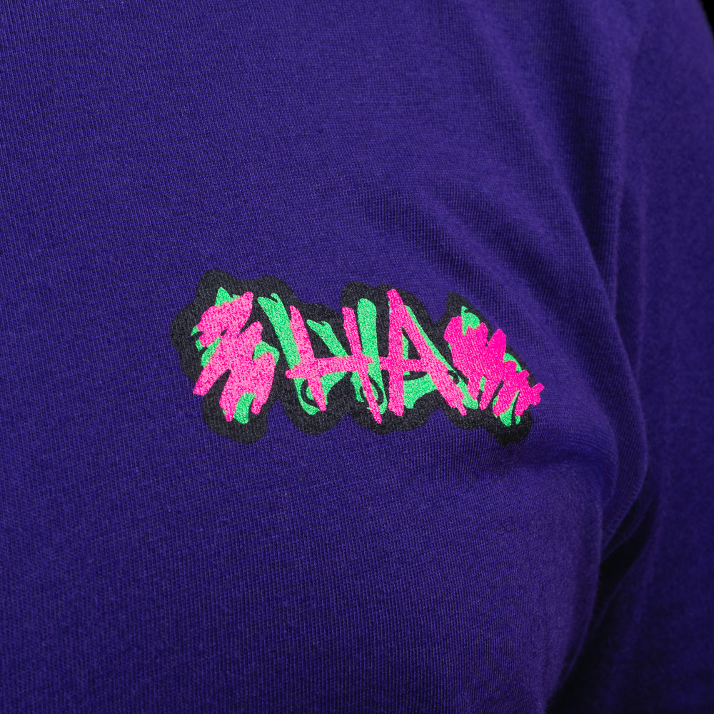 Purple SWAG t-shirt with neon joker skull king graphic and graffiti HA scribbles on the back.