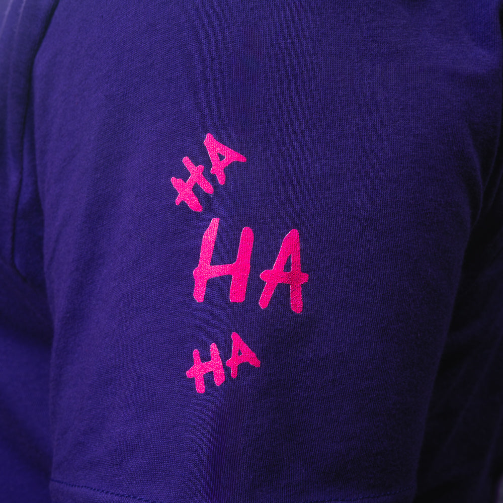 Purple SWAG t-shirt with neon joker skull king graphic and graffiti HA scribbles on the back.