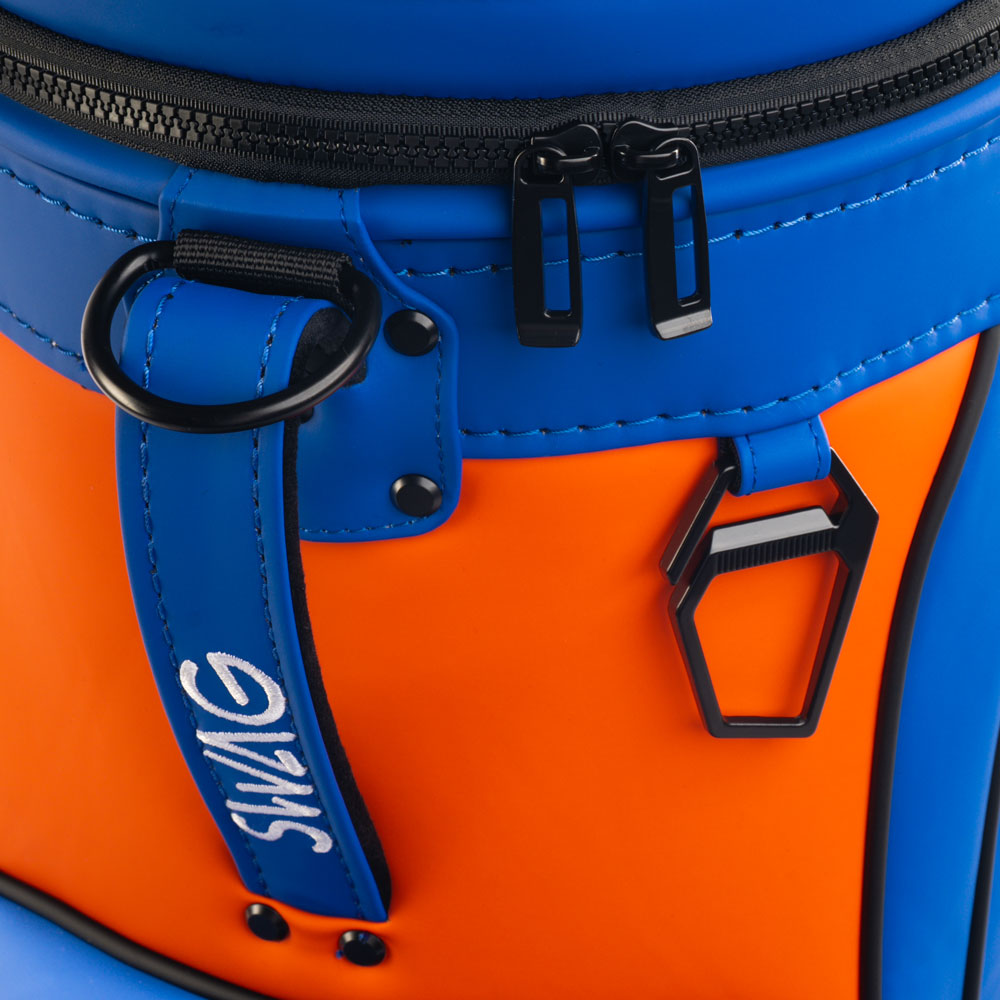 Florida Gators Get Out of Our Swamp Den Caddy Cooler close-up featuring orange panel, blue SWAG zipper pull, black zippers, and metal bottle opener