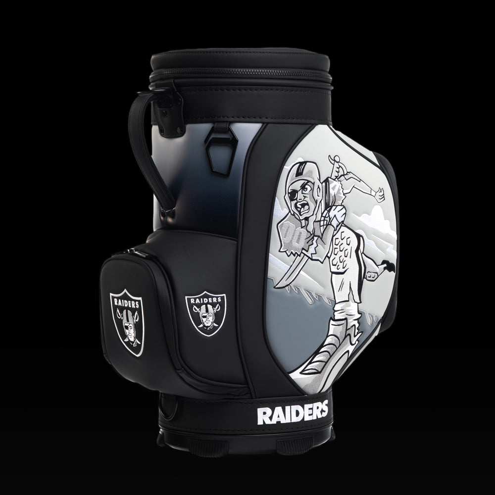 Angled view of the SWAG Golf Las Vegas Raiders Den Caddy Cooler showcasing the skeleton pirate artwork and embroidered Raiders logo pocket.