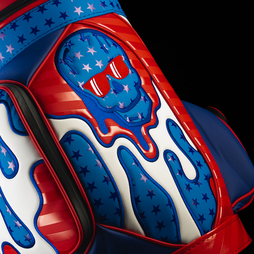 Close-up of the embroidered patriotic skull design and stars and stripes artwork on the American 3D Drip Skull Den Caddy Cooler.
