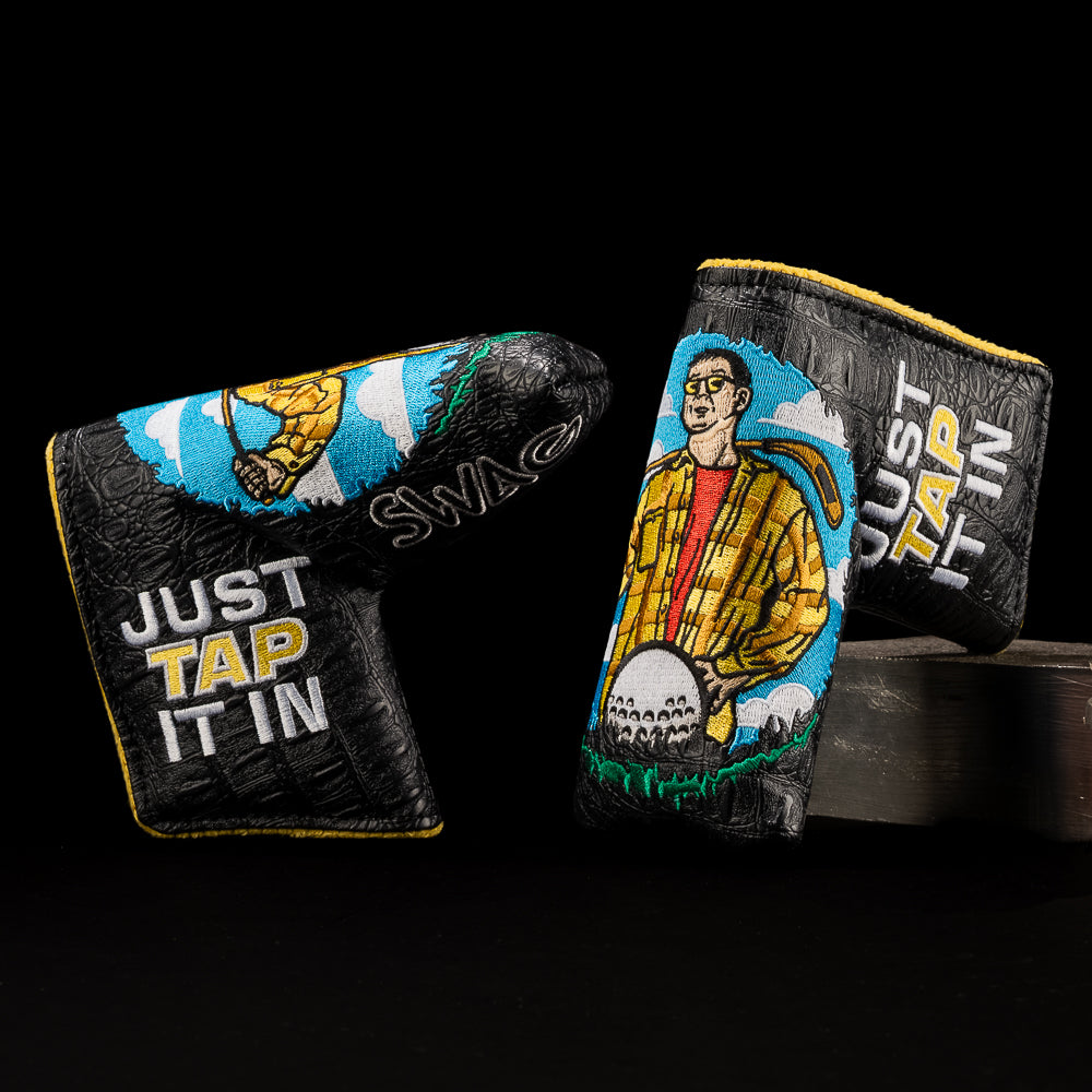 Blade putter headcover with front-facing Happy Gilmore artwork and embroidered Just Tap It In on black croc background.