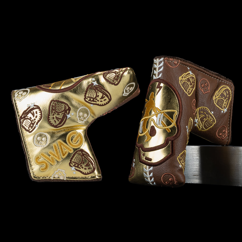 Gold and brown Swingman Skull blade cover with metallic skull icons, baseball gloves, and SWAG branding.