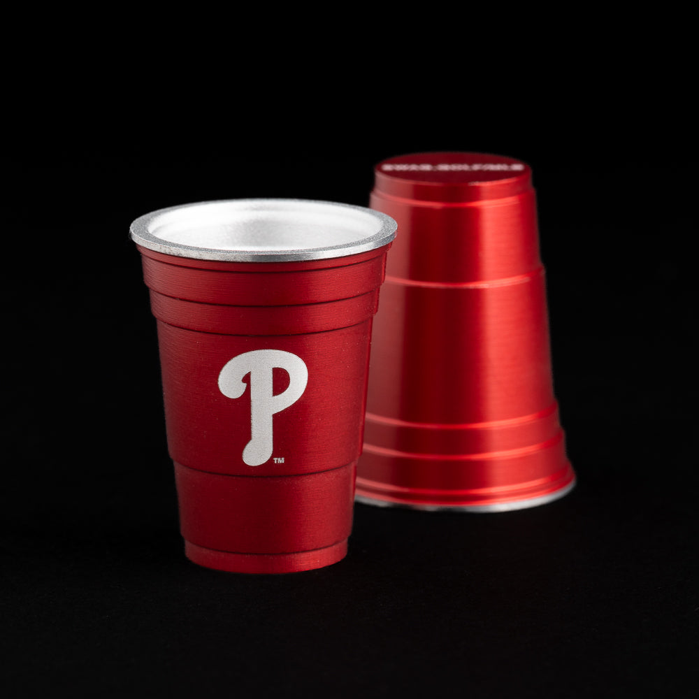 Red flip cup ball marker with the Philadelphia Phillies logo.
