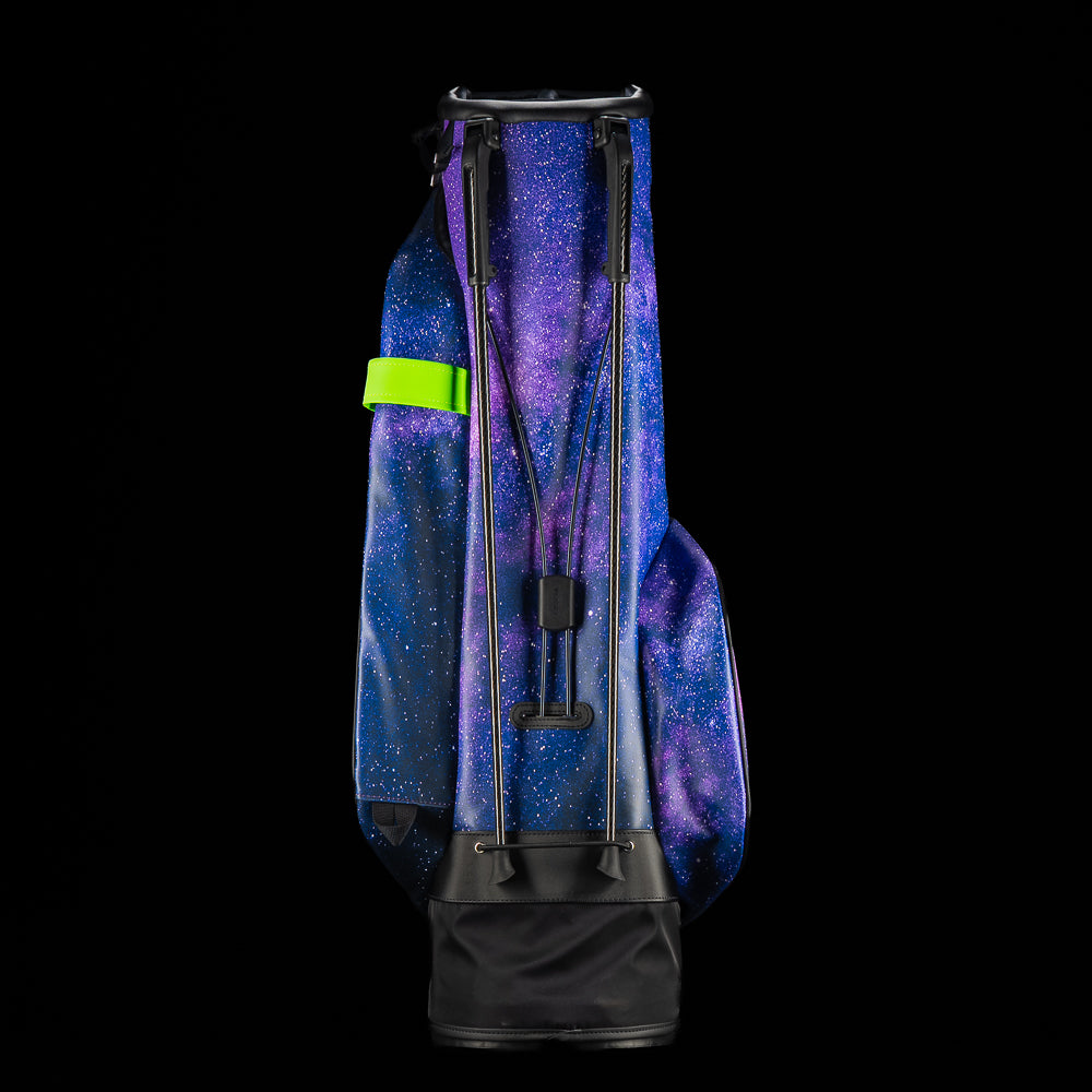 SWAG Golf x Vessel Lux Stand Bag with a purple and blue galaxy and playing card theme.