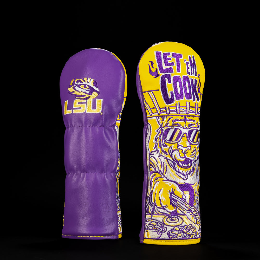 Purple and gold LSU fairway golf headcover featuring the LSU tiger eye logo, bold “Let ’Em Cook” lettering and illustrated tiger chef artwork.