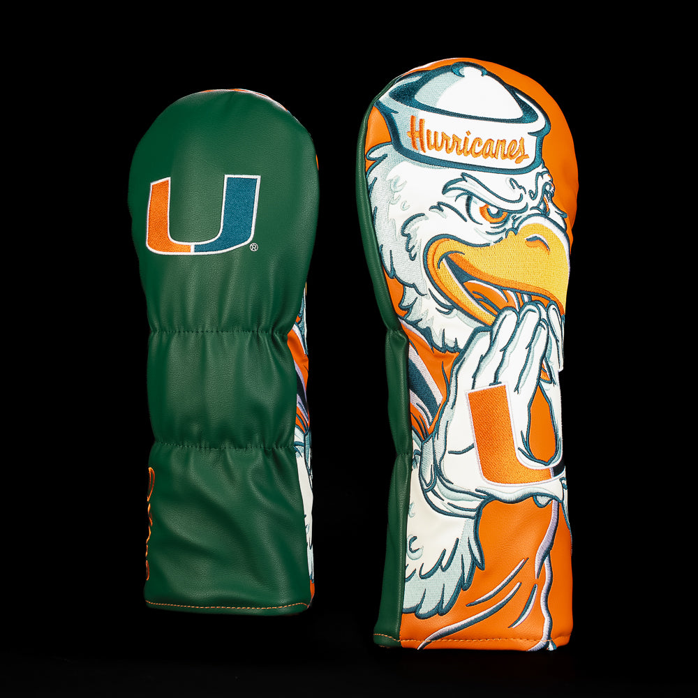 Green, orange and white Miami Hurricanes driver golf headcover featuring the U logo and oversized Sebastian the Ibis mascot artwork in Hurricanes gear.