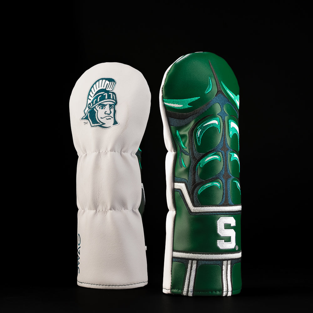 White and green Michigan State fairway golf headcover featuring the Spartan helmet logo and sculpted metallic green Spartan armor and abs design.