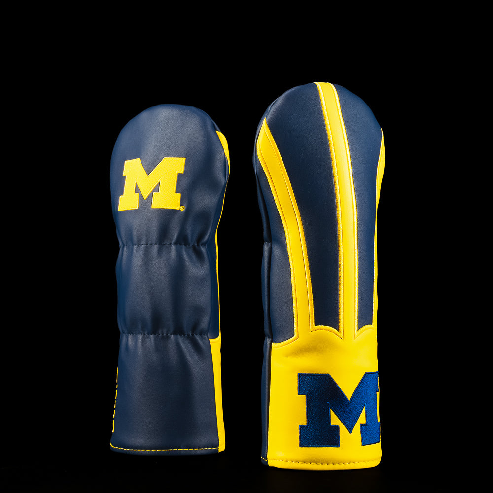 Navy and maize Michigan fairway golf headcover featuring the Block M logo and bold maize striping inspired by the Wolverines football helmet.
