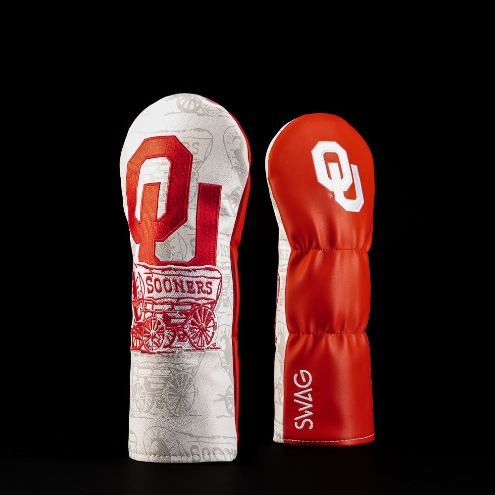 Crimson and white Oklahoma Sooners fairway golf headcover featuring oversized OU lettering, Sooners graphics and tonal illustrated details.