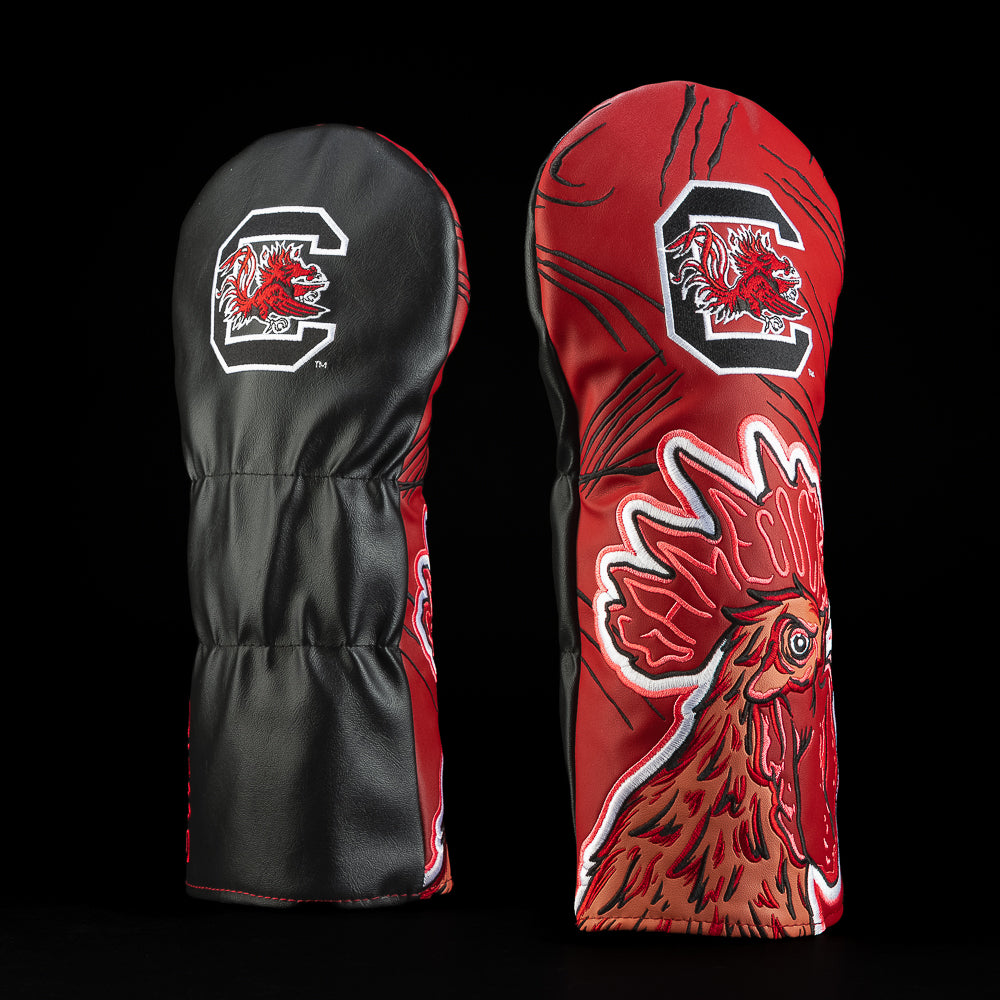 Black and garnet South Carolina driver golf headcover featuring the Gamecocks logo and oversized illustrated fighting rooster artwork.
